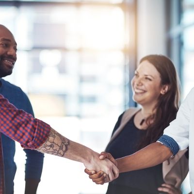 Adults shaking hands forming a partnership