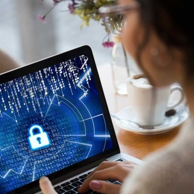 Female on laptop showing a locked screen for security 