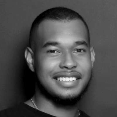 A headshot of a smiling Hilary Orange stood facing directly into the camera