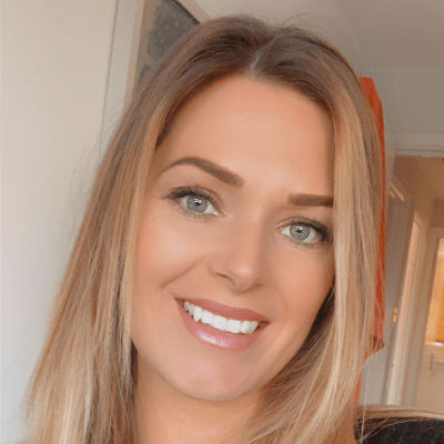 A headshot of a smiling Sophie Evans stood looking directly into the camera