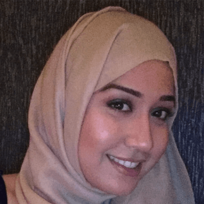 A headshot of a smiling Mariya Shah who is looking directly at the camera