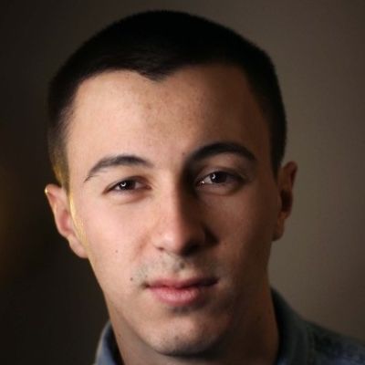 A head shot of a smiling Jake Kernot, a Dance and Performance alumni