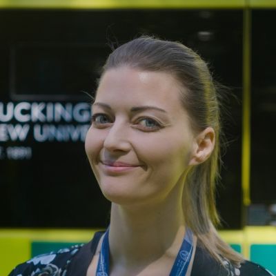 Kelly Sluman smiling facing towards the camera