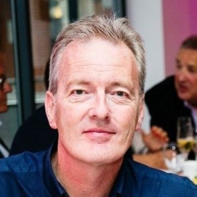 Head shot of a smiling Tom McGorrian, a lecturer at BNU, looking directly into the camera