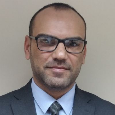 Headshot of a smiling Muntasir AlAsfoor