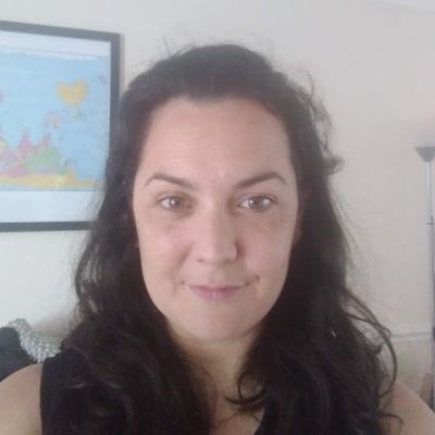 A head and shoulders shot of a smiling Alex Balfour, looking directly into the camera