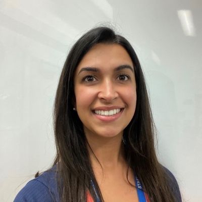 A head shot of a smiling Henne Magalhaes, a BNU Sports Therapy graduate