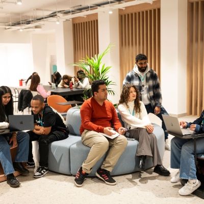 Group of students hanging out in the Atrium
