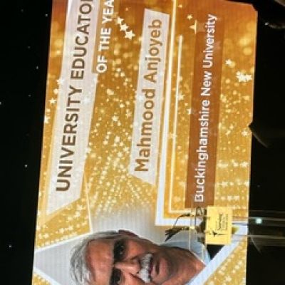 Display shows 'University Educator of the Year: Mahmood Anjoyeb'