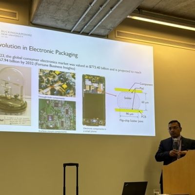 Man at the front of lecture theatre