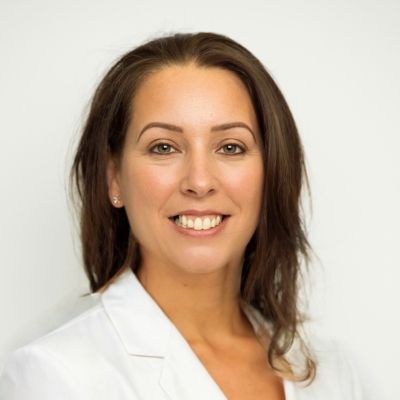 A headshot of a smiling Donna Collins, facing directly to the camera