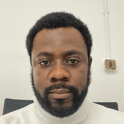 Headshot of Alaoma Alozie, a Senior Lecturer in Business Managemetn at BNU.