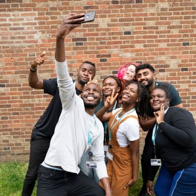 Group of students taking a selfie with a smartphone