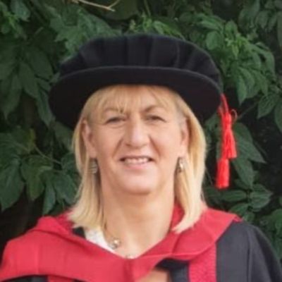Headshot of Rachel Tate in a graduation gown and cap.