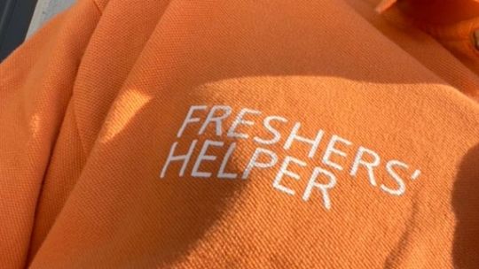 Freshers helper orange jumper close up