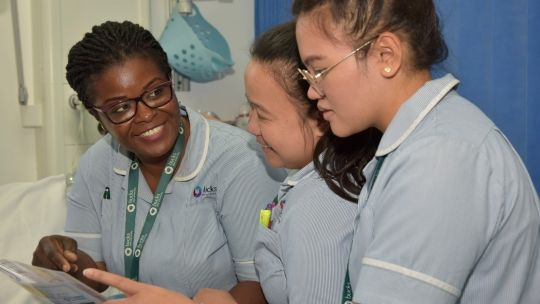 Three student nurses in uniform
