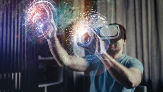 Man using VR headset inside.  