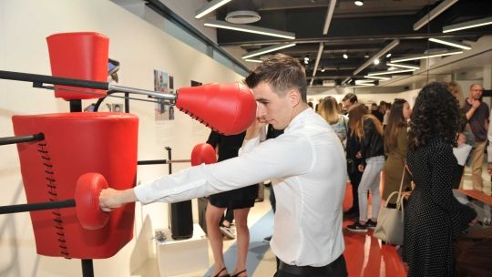 Male student testing out a boxing punch bag product