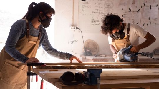 Two students (one female one male) using product design workshop 