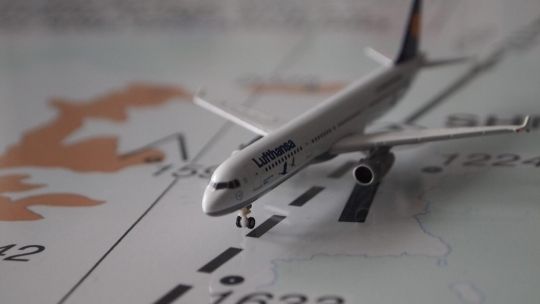 miniature plane on a map aviation