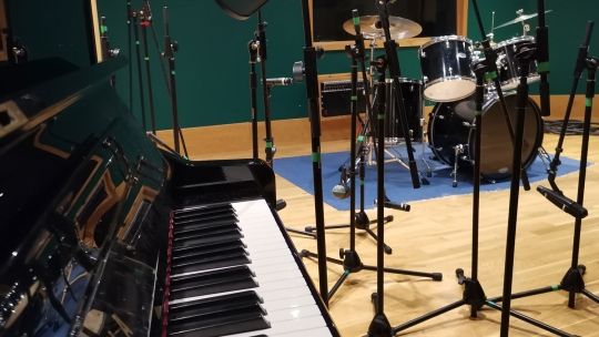 Piano and equipment close up in Audio studios