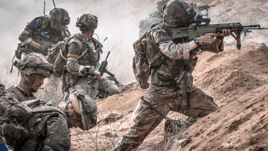 Men in army uniform during training