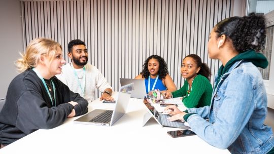 Students sat around a table 
