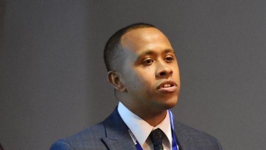 Jermaine Ravalier speaking at an event