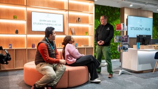 students in the student hub in atrium