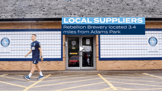Still from Wycombe Wanderers student film shows David Wheeler walking out of Adams Park stadium