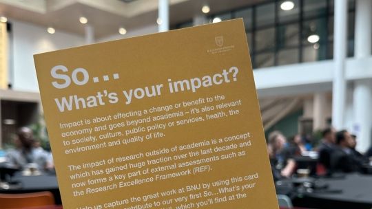 Flyer held up with question 'So... what's your impact?'