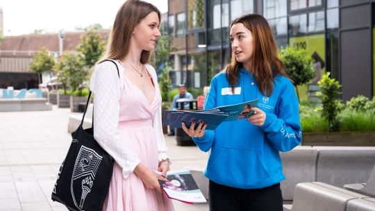 Student Ambassador talking to prospective student at an Open Day
