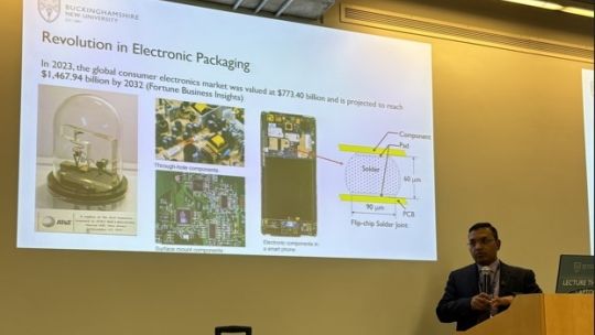 Man at the front of lecture theatre