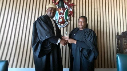 Joy Dellah-Gu with law lecturer