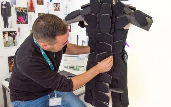 A student attending to his mannequin 