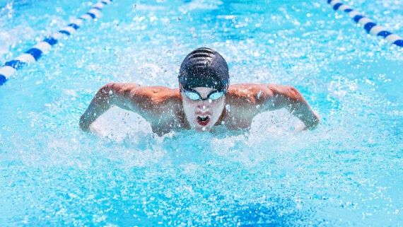 man swimming in a pool