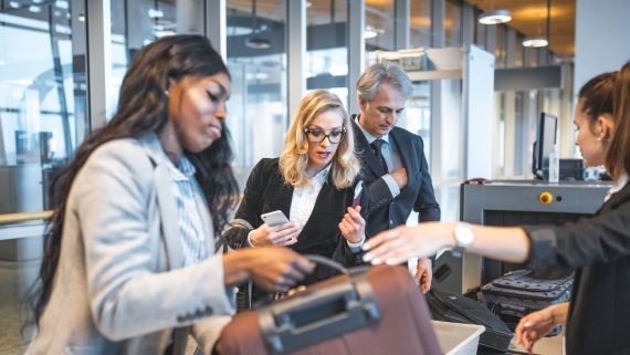 Group of people at airport security 