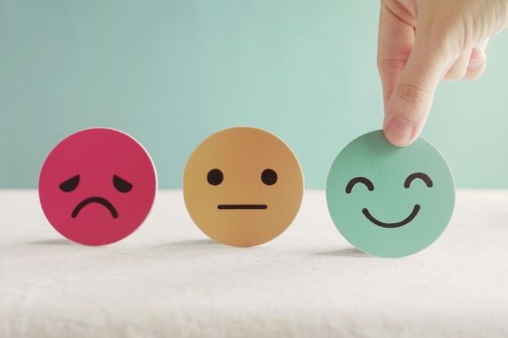 Three faces to show different emotion - mental health