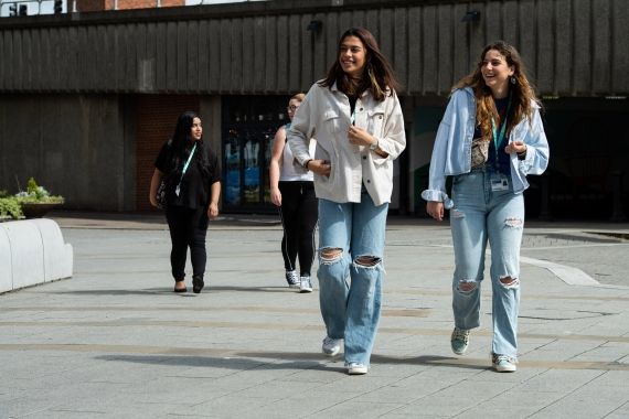 Two female students walking outside High Wycombe campus