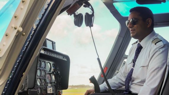 aviation student sat in a plane operating controls