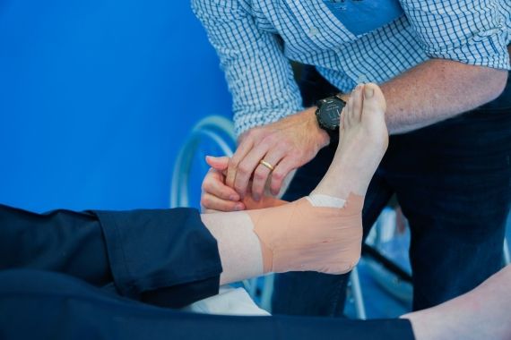 Physiotherapy session exercises with foot