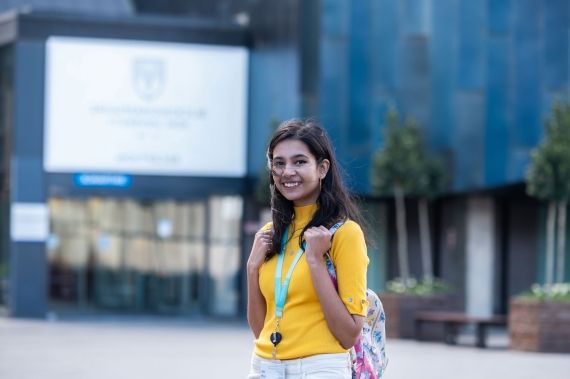 Smiling student outside Gateway building