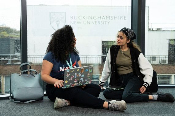 Students with laptops in High Wycombe campus
