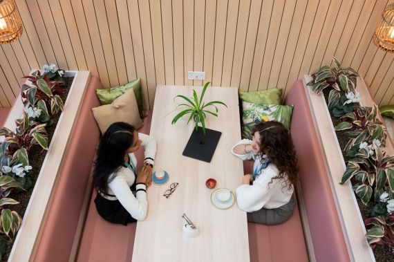 Two students sat together in the Garden Cafe