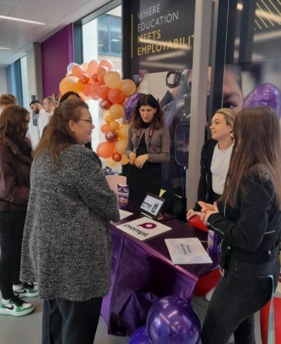 Business students presenting their work at the year-end showcase