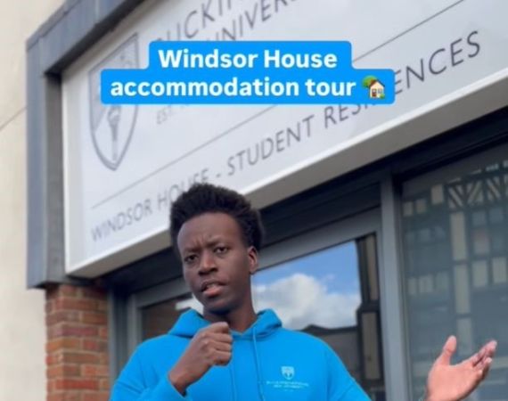 Headshot of ambassador Tegjwok stood outside of Windsor House halls of residence.