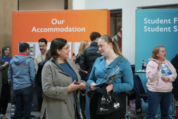 Two prospective students chatting during an open day visit
