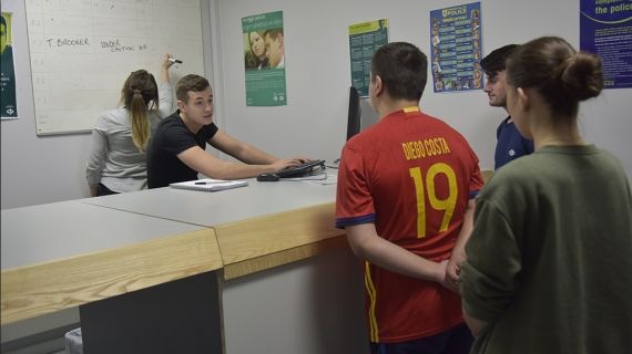 Man being handed in to a police station 