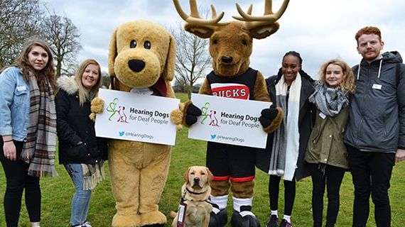 Dana and four of her colleagues stood at a charity event