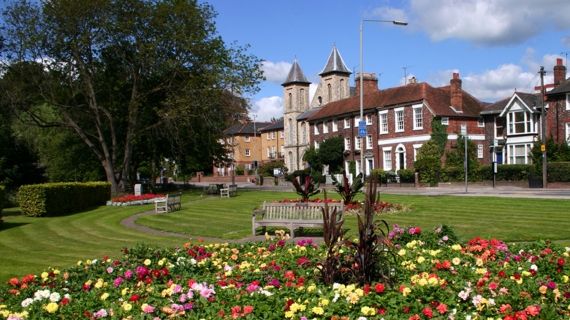 Benches and flower garden in front of town buildings in High Wycombe